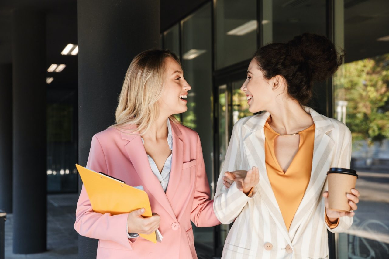 Two women walking together with ease